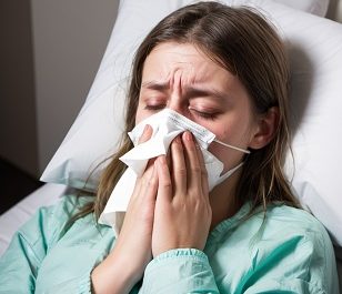 Person resting in bed to fight viruses .